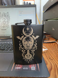 hip flask with engraved skull design